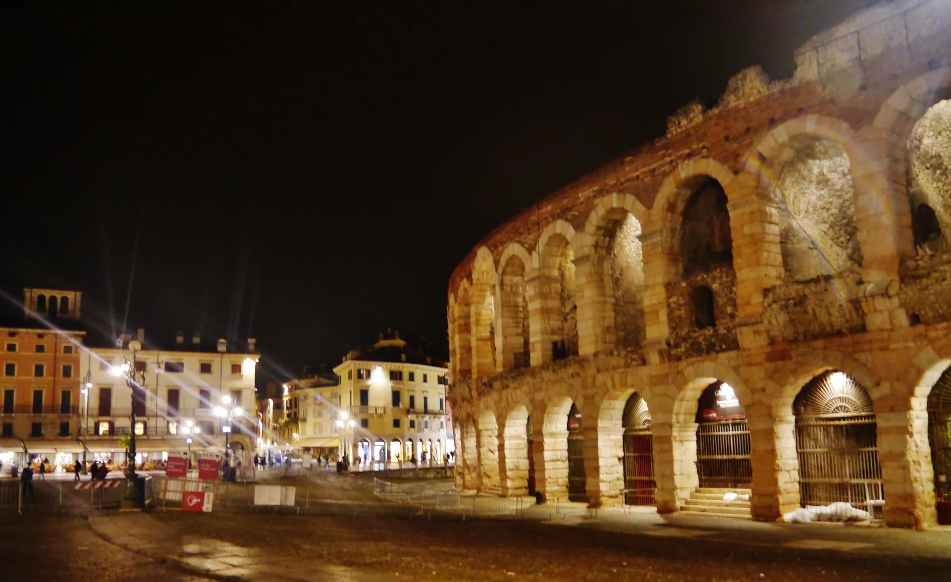 The Arena di Verona, a Roman amphitheatre, illuminated at night in Piazza Bra